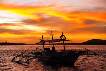 Fototapeta premium Sunset in Balabac Island, located at the southernmost tip of Palawan, Philippines, is a remote, 