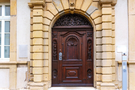 Ornate Antique Wooden Door and Stone Archway in Porrentruy, Switzerland