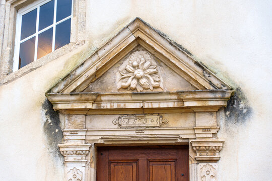 Ornate 1590 Stone Pediment above Historic Doorway in Porrentruy