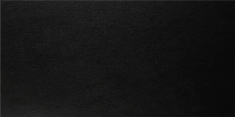 Fototapeta premium An enigmatic, solid, black surface, revealing the nuances of a unique, textured, and moody appearance.