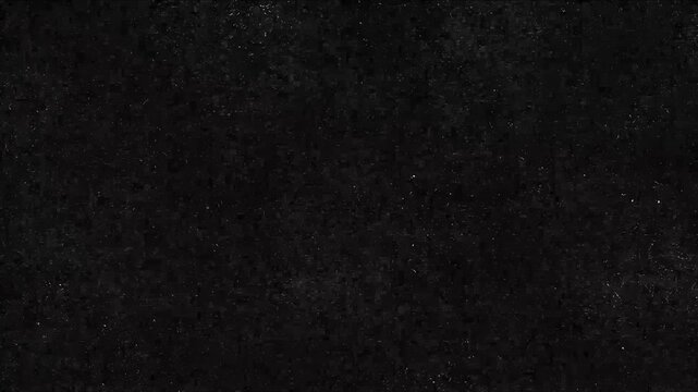 Dark monochromatic texture with heavy grain and subtle white dust particles on a black background. This file can be used as an atmospheric overlay for vintage or cinematic video projects.