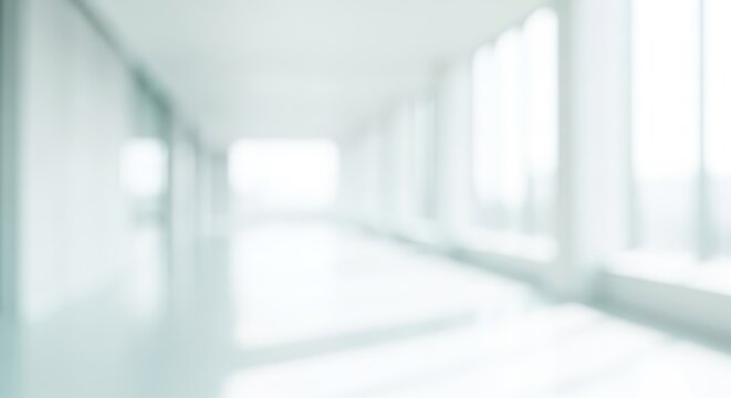 Blurred bright white modern office hallway interior background