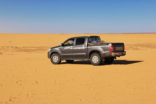Chinguetti, Mauritania - 11 Jan 2022: Cars on sand dunes of Sahara Desert , Mauritania, West Africa