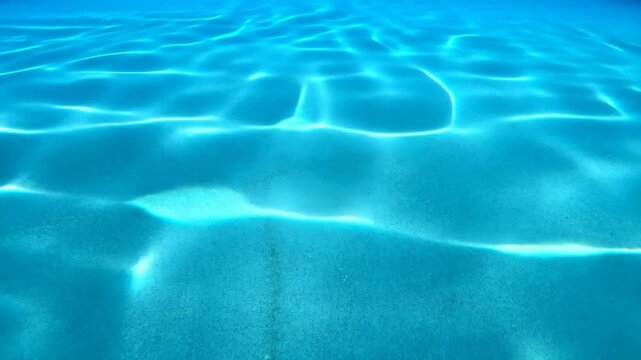 Water surface caustics with turquoise tones, abstract light patterns on blue liquid, underwater wavy ripples, bright luminous reflections, serene