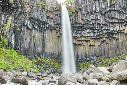 Svartifoss waterfall dropping past dark hexagonal basalt columns