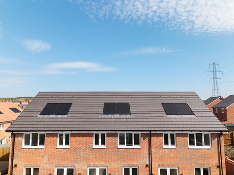 The roof of a new build house with integrated solar panels