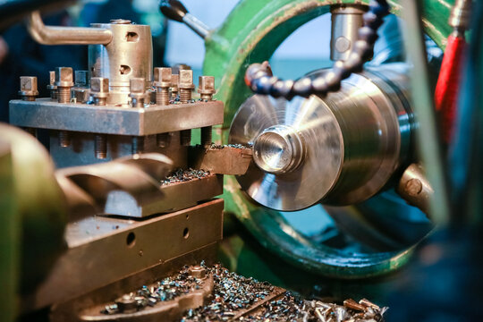 CNC lathe processes metal detail.