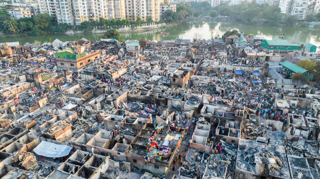 Aerial view of a densely packed urban settlement, a chaotic mix of structures and debris, showcasing the city's vibrant yet challenging urban landscape, Dhaka, Dhaka Division, Bangladesh.
