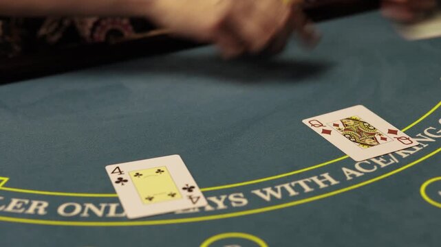 Casino Dealer Dealing Cards at Poker Table with Chips