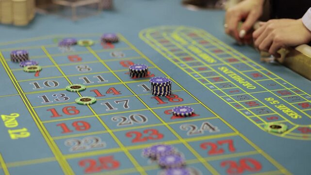 Casino Dealer Dealing Cards at Poker Table with Chips