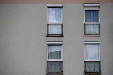Obraz premium Apartment windows on concrete facade