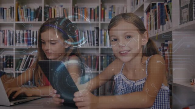 Two students typing on laptop and tapping tablet in library, tablet tap initiating HUD for learning