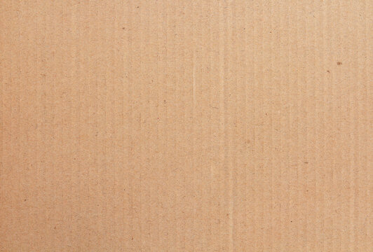 Cardboard sheet texture background, detail of recycle brown paper box pattern.