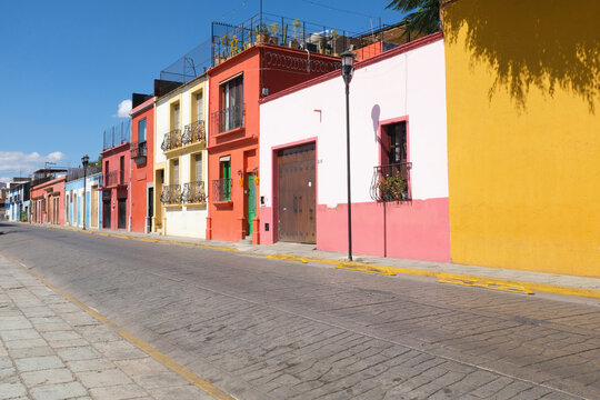 Row of colorful houses and empty street