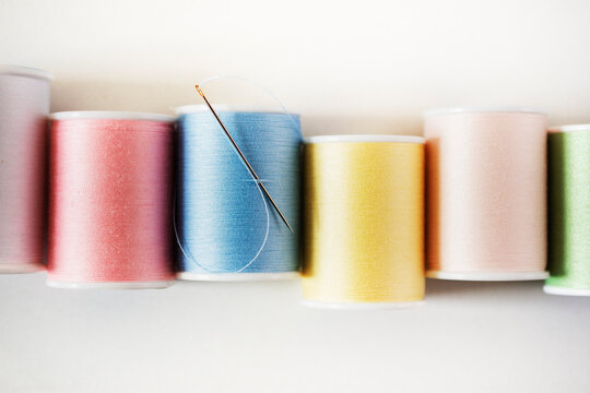 Studio shot of colorful spools of threads