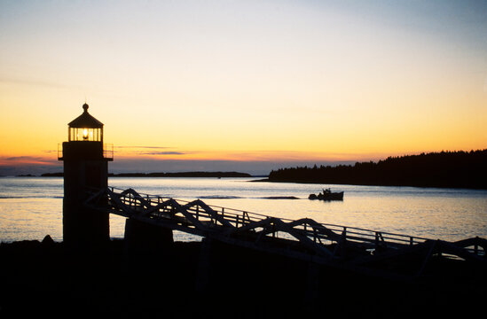 Silhouette of Marshall Point Light at sunset