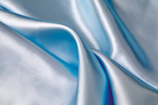 Close-up of folded light blue silk
