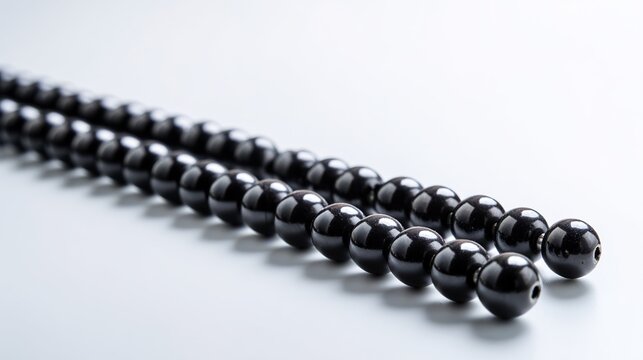 abacus. Black abacus beads arranged with mathematical precision on a stark white surface. STEM education sheets, lab safety posters, designed for biotech research communications.