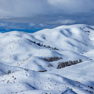 Clouds above snow covered fields