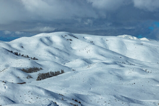 Clouds above snow covered fields