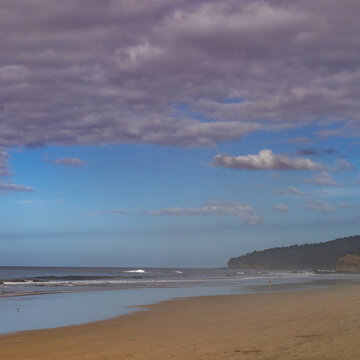 Thick clouds over empty beach