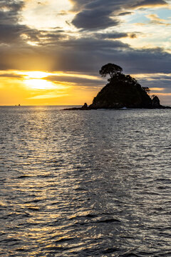 Silhouette of small island at sunset