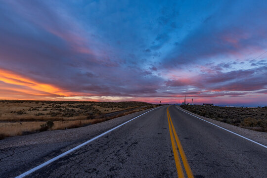 Dramatic sunrise sky above empty Interstate 84