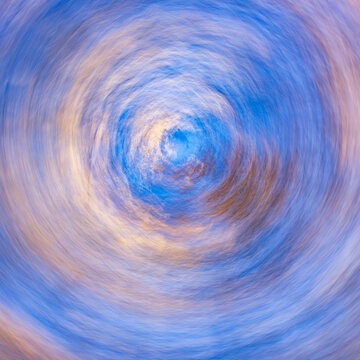 Low angle view of trees against sky, motion blur