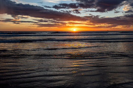 Sunset over calm ocean on Playa Grande