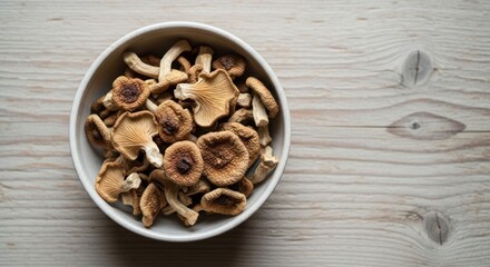 Fototapeta premium Bowl of Honey Mushrooms on Wooden Tabletop - A Culinary Delight.