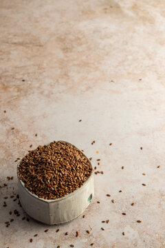 Whole flaxseed in a ceramic bowl 