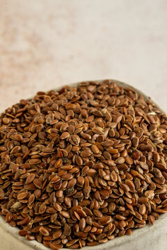 Whole flaxseed in a ceramic bowl 