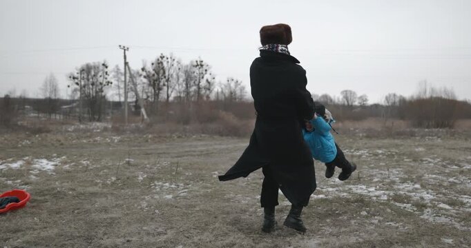 Man and kid boy go for walk. Dad and son play outside. 4K 10-bit