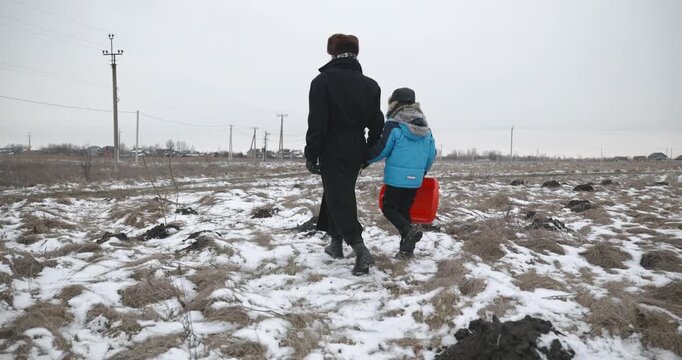 Man and kid boy go for walk. Dad and son play outside. 4K 10-bit