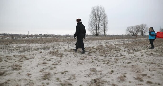 Man and kid boy go for walk. Dad and son play outside. 4K 10-bit