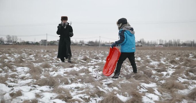 Man and kid boy go for walk. Dad and son play outside. 4K 10-bit