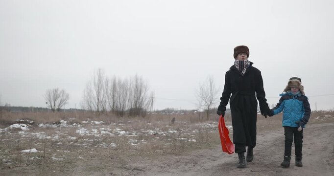 Man and kid boy go for walk. Dad and son play outside. 4K 10-bit