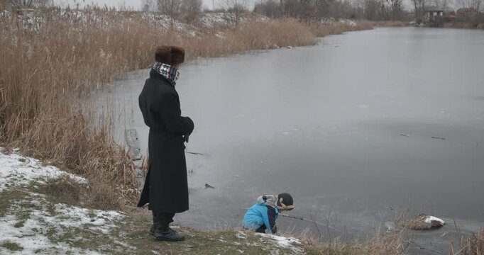 Man and kid boy go for walk. Dad and son play outside. 4K 10-bit