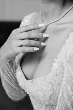 Elegant Bride with Diamond Necklace and Rings on Wedding Day, Black and White Portrait