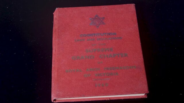 A red constitution book of the Royal Arch Freemasons of Victoria from 1949.