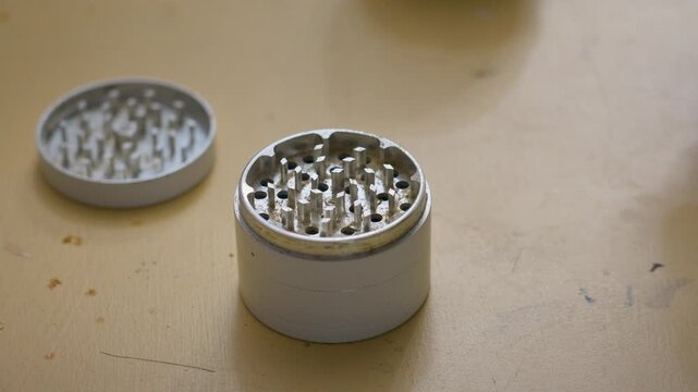 Speed ramped clip of a person placing cannabis onto the teeth.