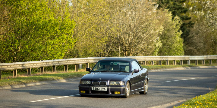 Milton Keynes,Bucks,UK - Apr 8th  2026:  1999 BMW 3 series 318i classic car driving. on a British road