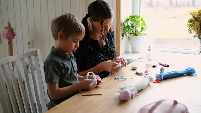 Happy Children Laugh and Fun Make DIY Toys. Kids Crafting from Fluffy wire, Bending Plush. Craft Pipe Cleaners. Leisure on Holidays. Thick Fluffy Chenille Stems for Arts. Supplies, Chenille Stems.