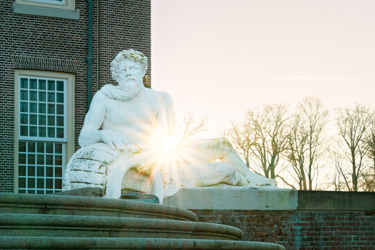 Sunburst pierces ancient stone, casting long shadows on brick walls.