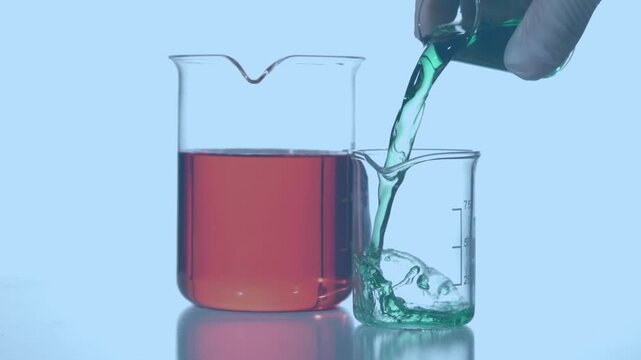 Animation of red shapes over hand of lab worker pouring reagent into glass on blue background