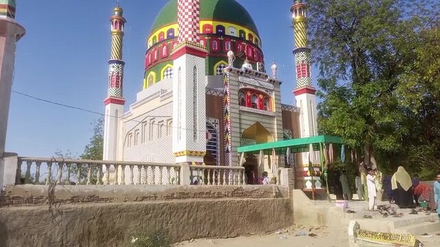Colorful Islamic Shrine Architecture with Green Dome in Pakistan