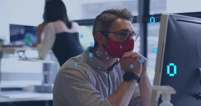 Seated man red mask glasses reacting to binary overlay in office clasping hands analyzing tech data