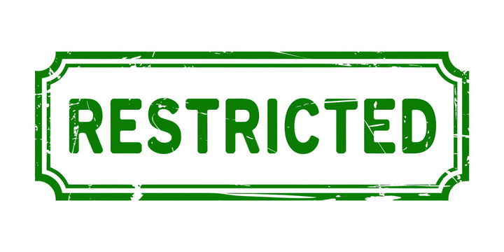 Green restricted stamp with white background and worn edges
