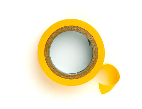 Yellow adhesive tape roll isolated on white background top view