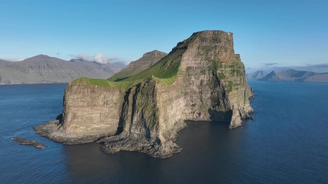 Drone shot of vertical cliffs of Kalsoy on Faroe Islands